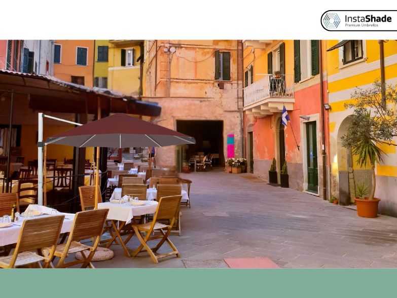 Maroon color cantilever umbrella in an outdoor seating cafe